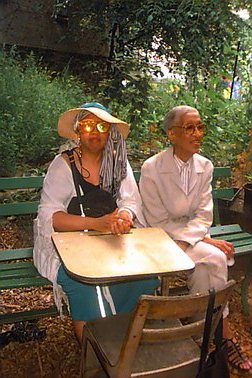 two ladies sitting on a bench